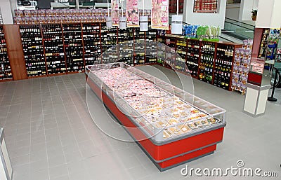 Wine shelves and refrigerator with the meat