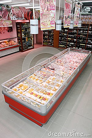 Wine shelves and refrigerator with the meat