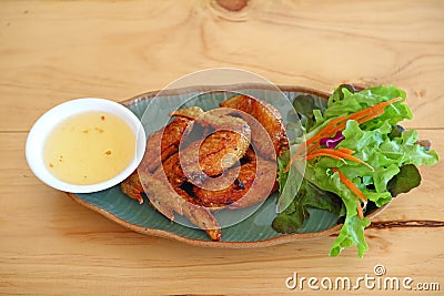 Wings fied chicken on dish in thai menu