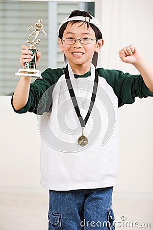 Winning boy with his medal and trophy