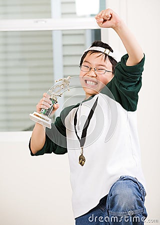 Winning boy with his medal and trophy