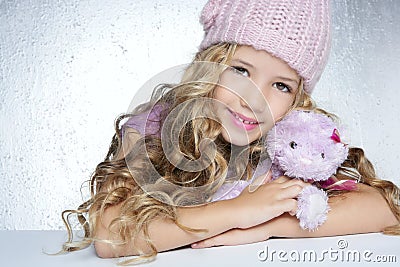 Winter fashion little girl hug teddy bear