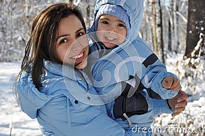 Winter portrait of mother and baby boy