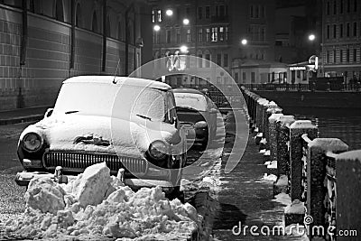 Winter in Saint-Petersburg: cars under snow, night