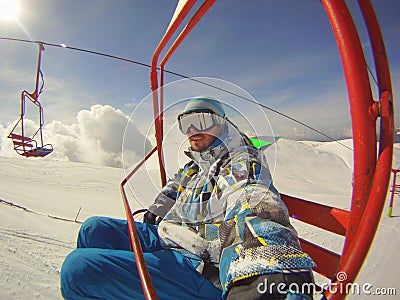 Winter sports - skier using cable car