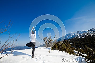 Winter yoga session in beautiful mountain place