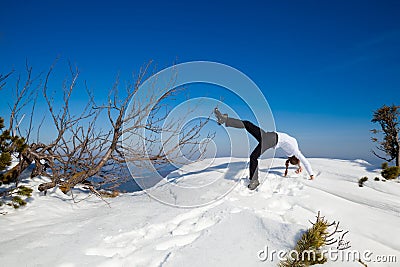 Winter yoga session in beautiful mountain place