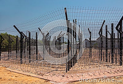Wire mesh and barbed wire.