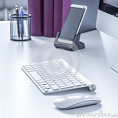 Wireless keyboard and mouse on a desk