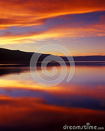 Wispy Clouds Over Lake at Sunset