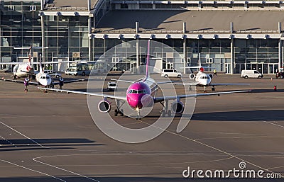 Wizz Air Airbus A320 aircraft running to the parking