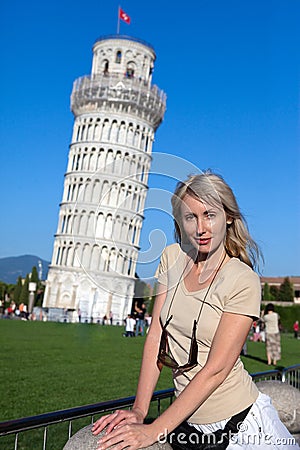Woman against a falling tower in Pisa