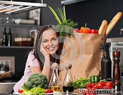 Woman in apron on a modern kitchen