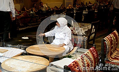 Woman baking bread in Istanbul