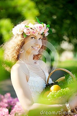 Woman with a basket of fruit in hand