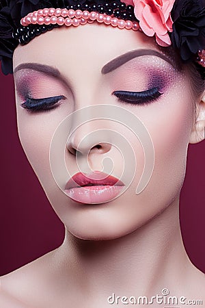Woman beautiful face closeup fashion portrait pink make up
