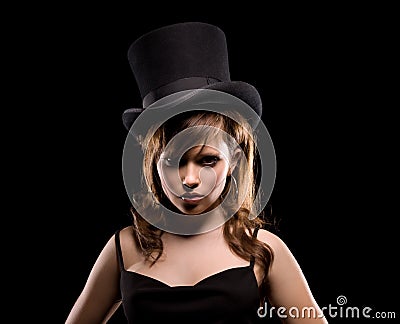 Woman in black dress and top hat