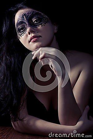 Woman in black mask
