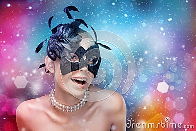 Woman with black masquerade mask with feathers