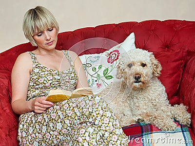 Woman with book and dog