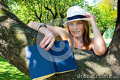 Woman with a book in her hand Smiling