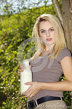 Woman with a bottle of milk