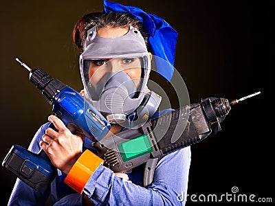 Woman builder with construction tools.