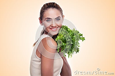 Woman with bundle herbs (salad). Concept vegetarian dieting - he