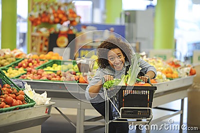 Woman buys fruit and food in supermarket