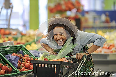 Woman buys fruit and food in supermarket