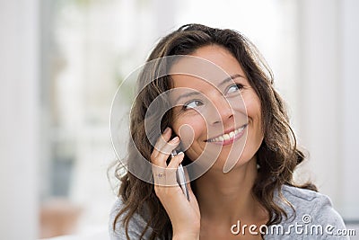 Woman calling with cellphone indoor