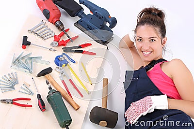 Woman carpenter with work tools
