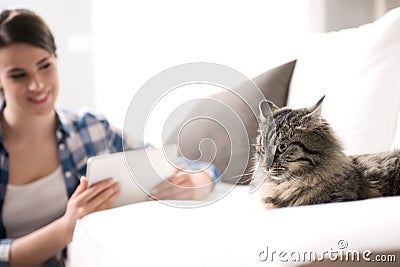 Woman and cat in the living room