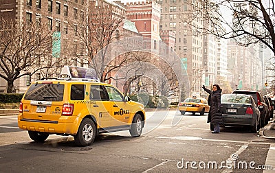 Woman catchs taxi in New York