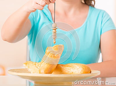 Woman checking food with pendulum