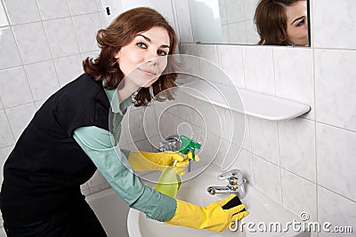 Woman cleaning the bathroom