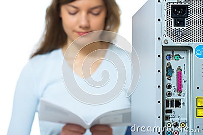 Woman, computer, instruction manual