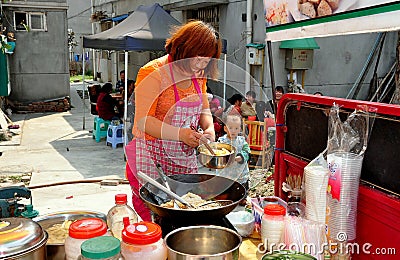 Pengzhou, China: Woman Cooking Food