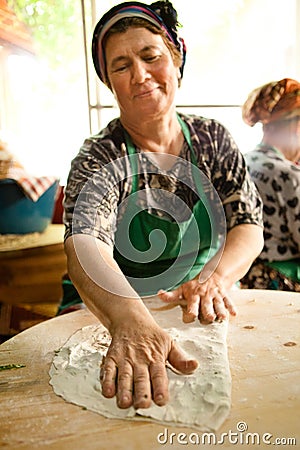 Woman cooks a traditional Turkish pancake