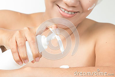 Woman with cosmetic cream