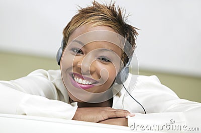 Woman on couch Listening to Headphones portrait close up