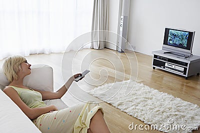 Woman On Couch Watching TV