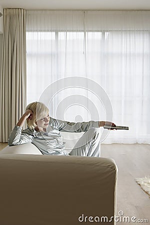 Woman On Couch Watching TV