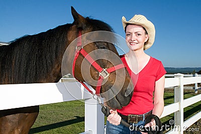 Woman in Cowboy Hat With Horse - Horizontal