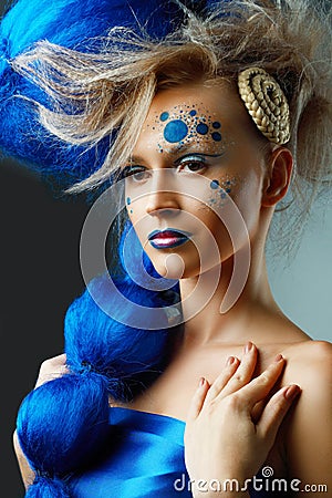 Woman with creative fantasy hairstyle