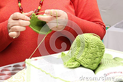 Woman crocheting a bonnet