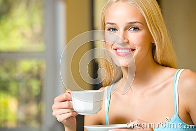 Woman with cup of coffee or tea