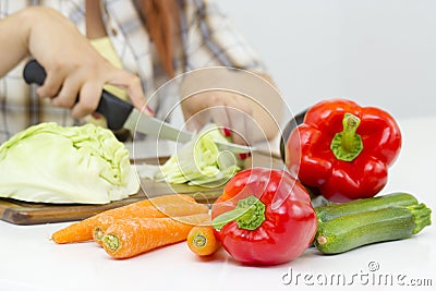 Woman cutting vegetables