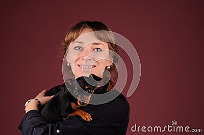 Woman with dog on the hands