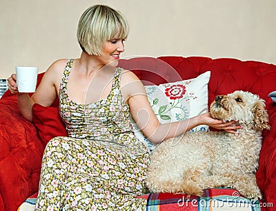 Woman and dog on sofa